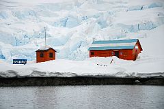 04B Two Buildings At Almirante Brown Station With Avalanche Glacier Behind From Zodiac On Quark Expeditions Antarctica Cruise.jpg